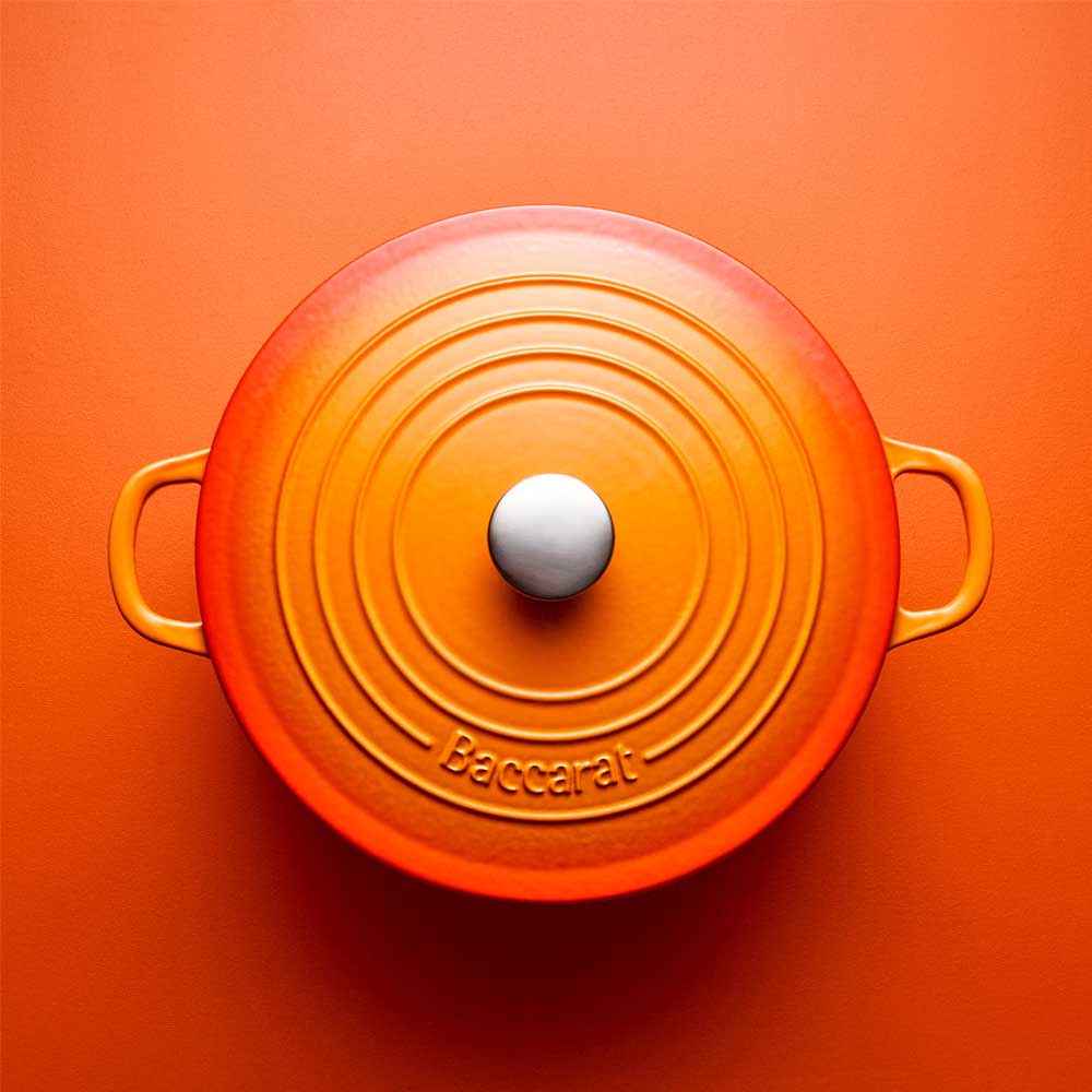orange cast iron dutch french oven with orange background - House
