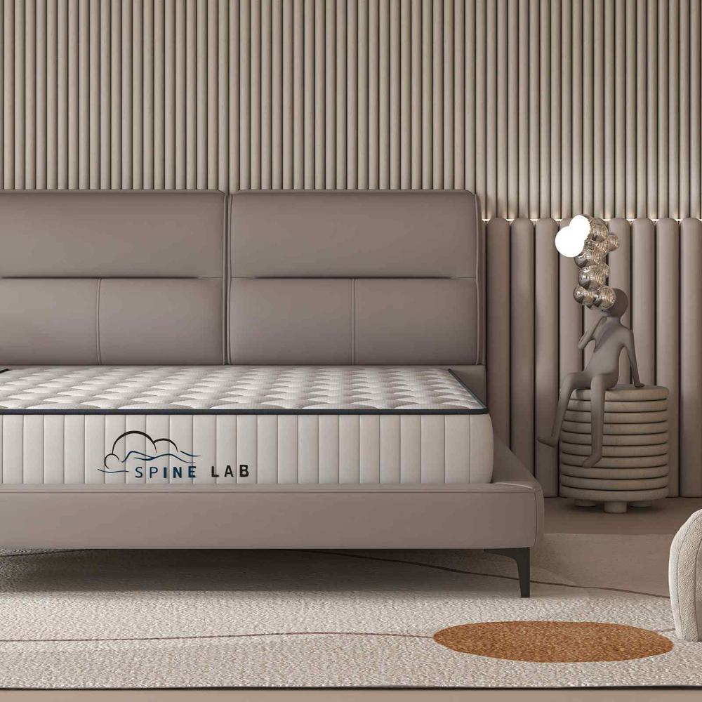 Spring Mattress on beige bedframe in bedroom - House