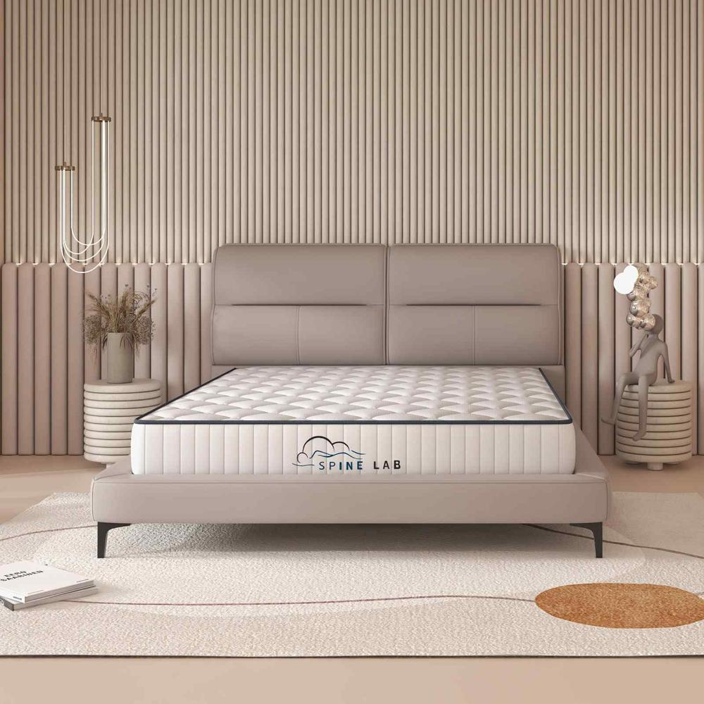 Spring Mattress on beige bedframe in bedroom - House