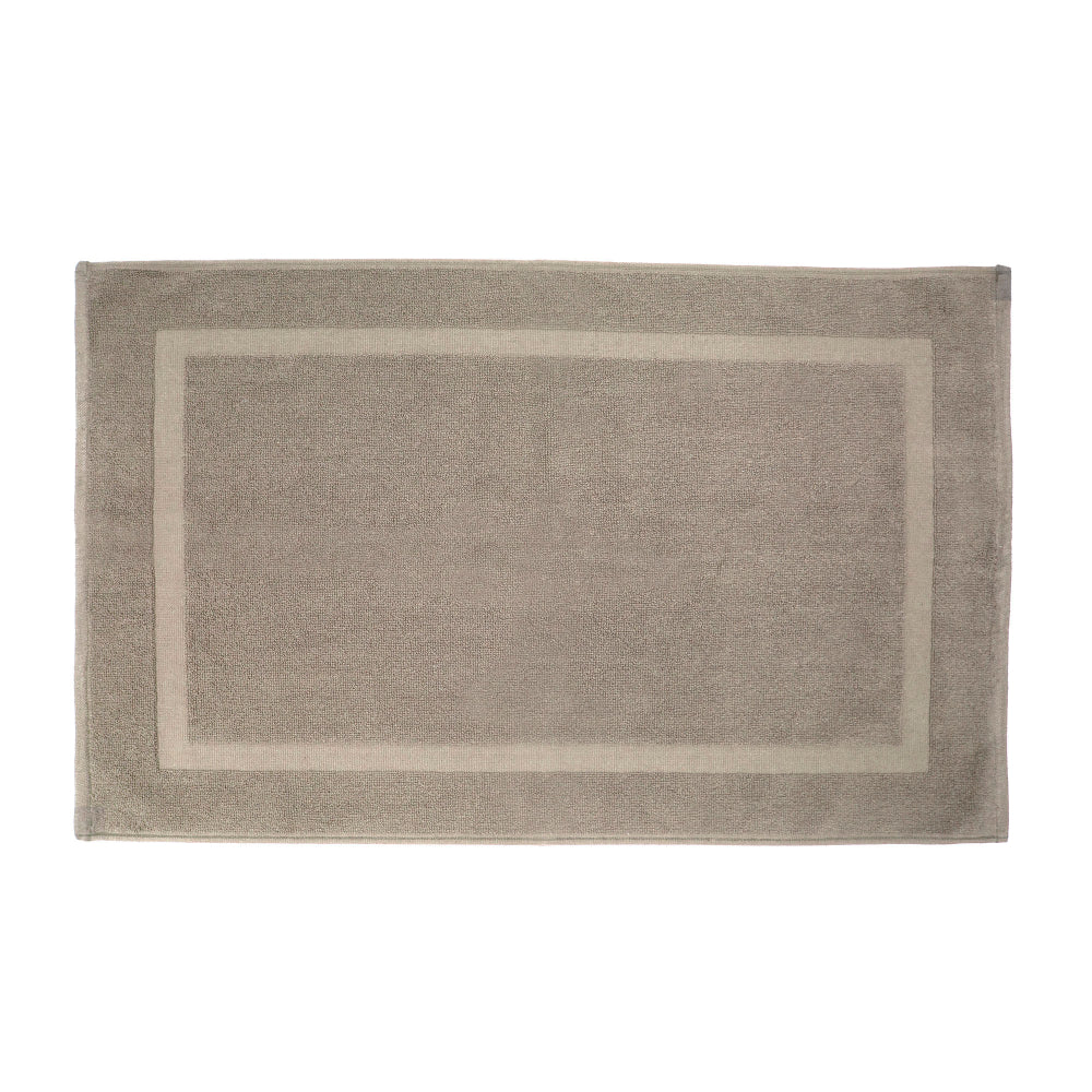 Latte coloured bath mat pictured on a white background.