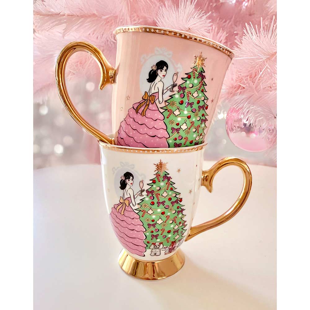 Ivory, pink and gold Christmas mug stack with woman holding a glass of champagne