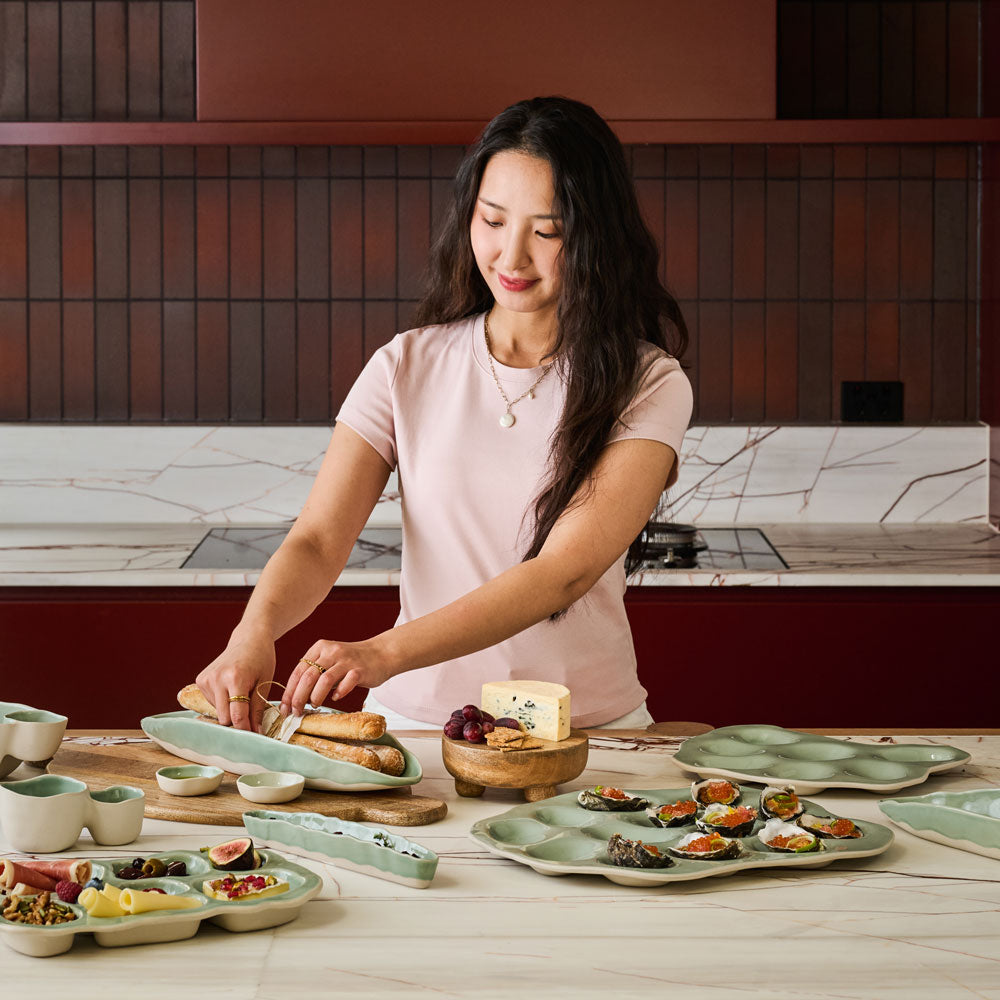 The Ecology Selvedge fold platter is displayed on a spread with baguettes on it.