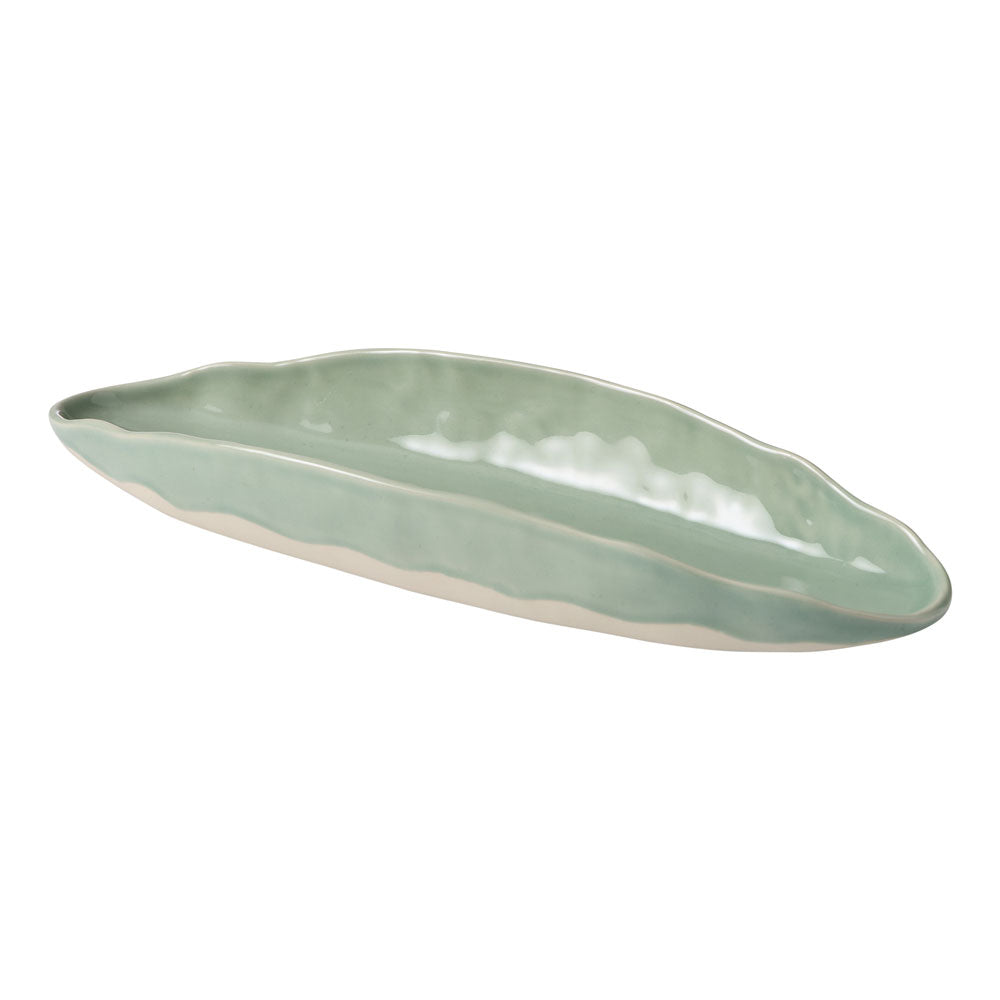 The Selvedge oval platter features a folded design with a soft green and cream tone.