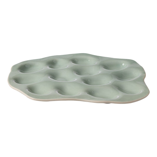 The Ecology Selvedge oyster plate with 13 slots for oysters or other shared plates, finished with the glossy green.