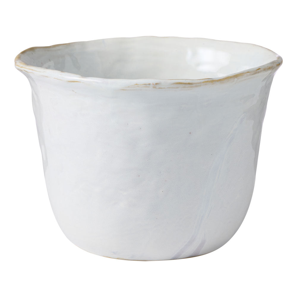 The Ecology Fieldstone planter in quartz displays a glossy white finish perfect for any home interior.