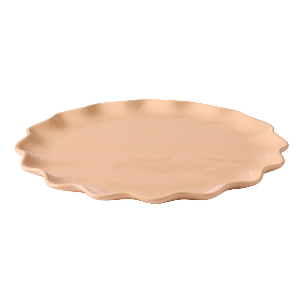 The Ecology round platter has a ruffle design around the edges and is in a soft petal tone.
