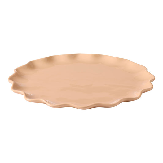 The Ecology round platter has a ruffle design around the edges and is in a soft petal tone.