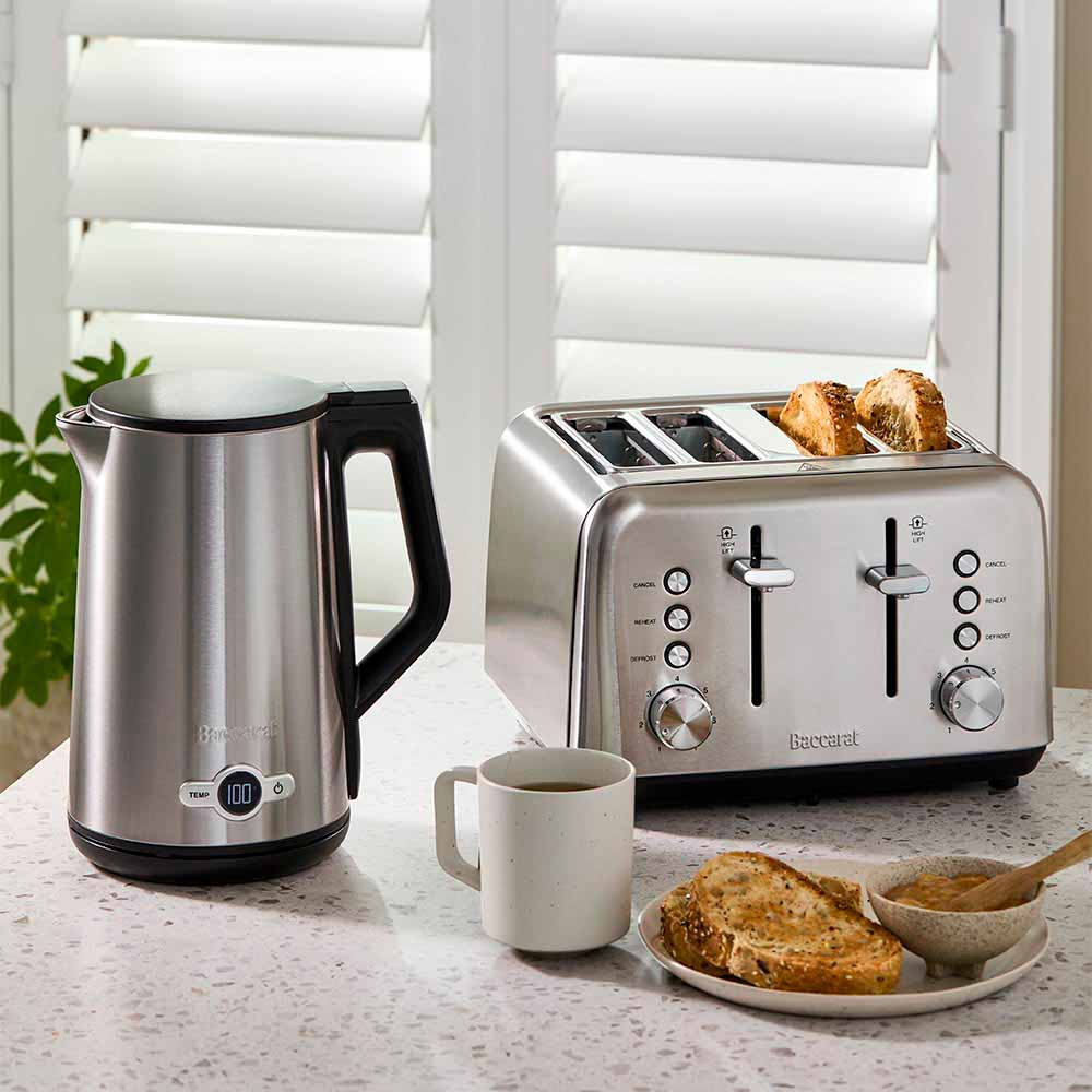 Baccarat The Boiling Point Tempcontrol Kettle in Silver at House. Silver kettle with cup of tea and matching toaster.