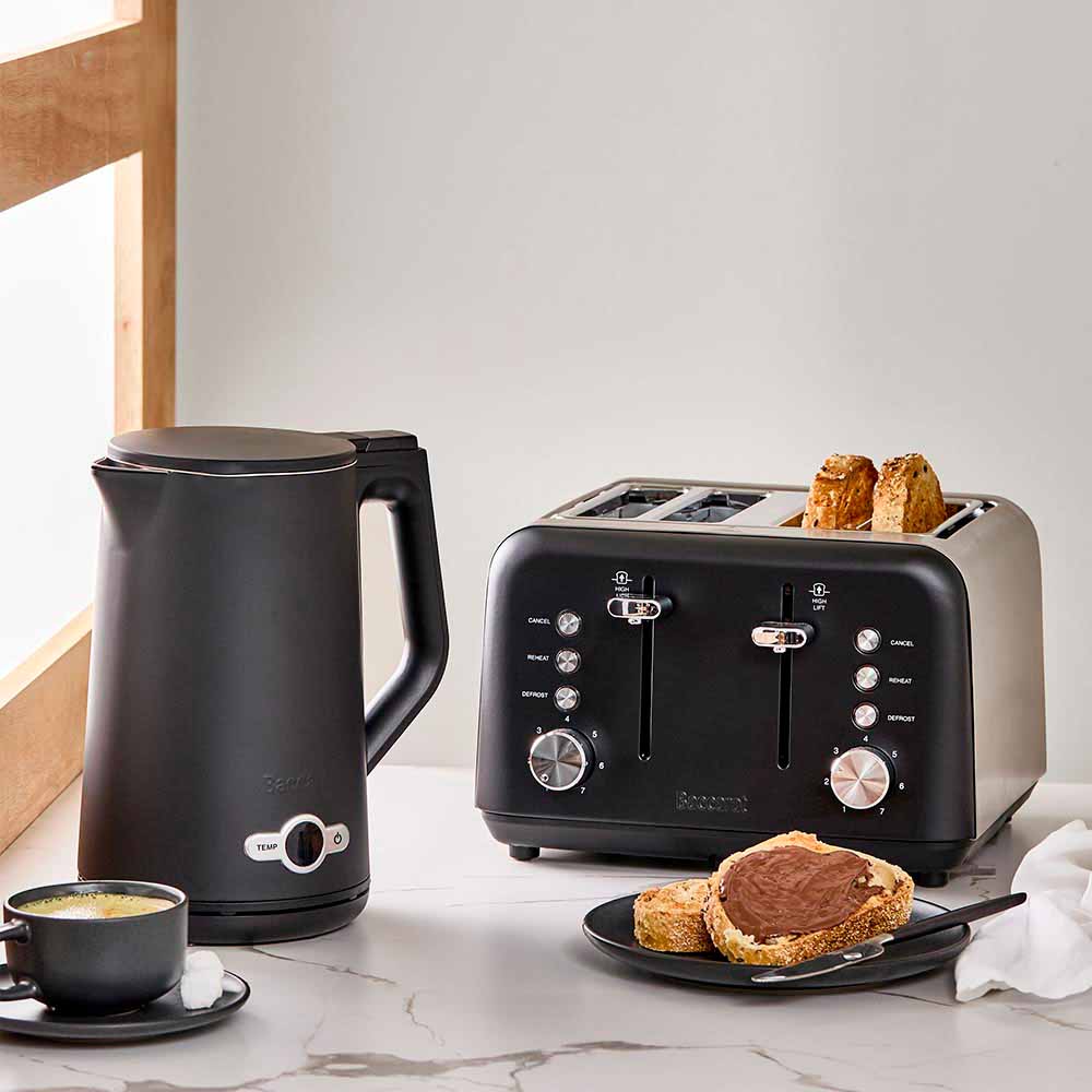 Baccarat The Boiling Point Tempcontrol Kettle in Black at House. Black kettle with matching black toaster on a kitchen bench.