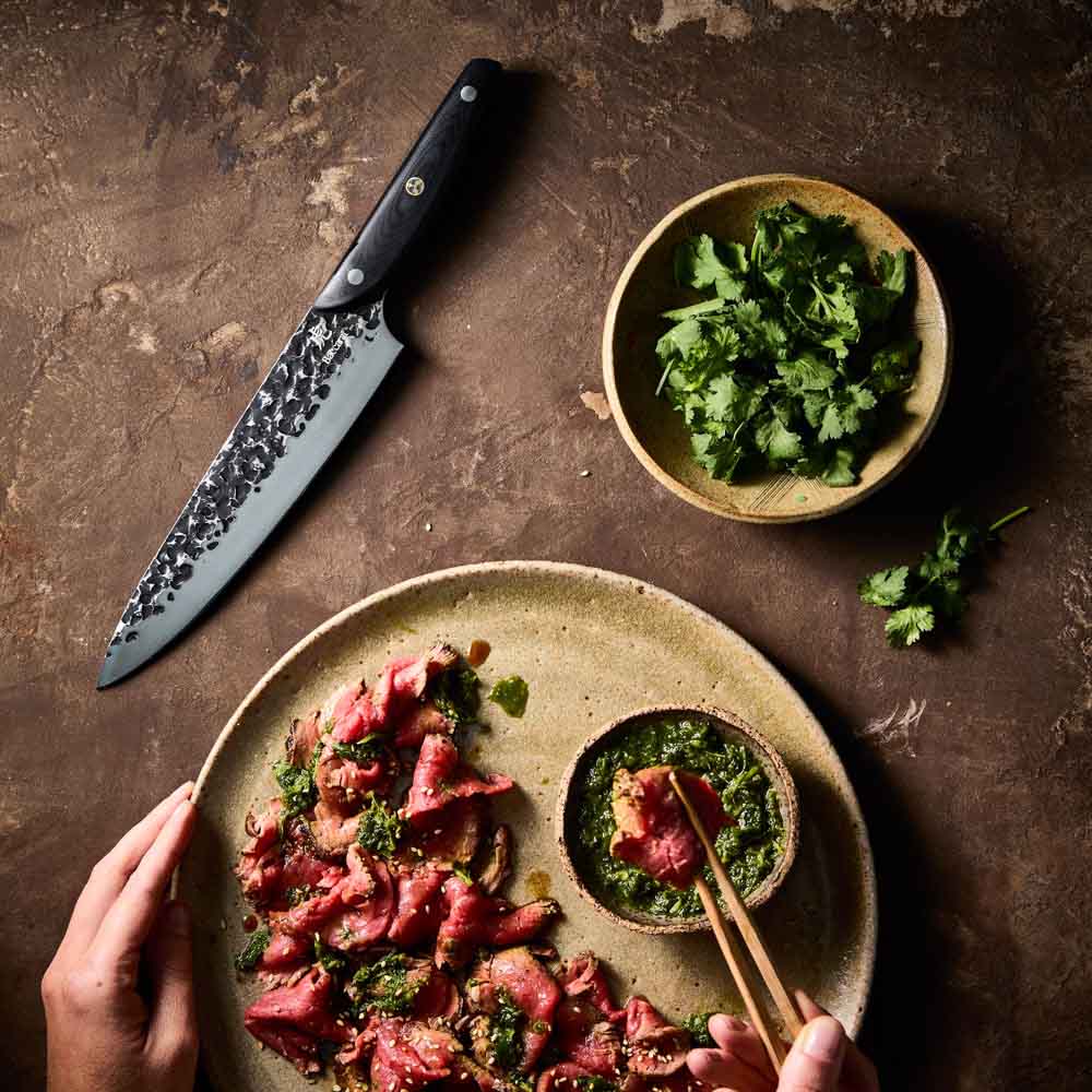 Man dipping sliced wagyu beef - Baccarat KUROI KIBA Chefs Knife 20cm at House