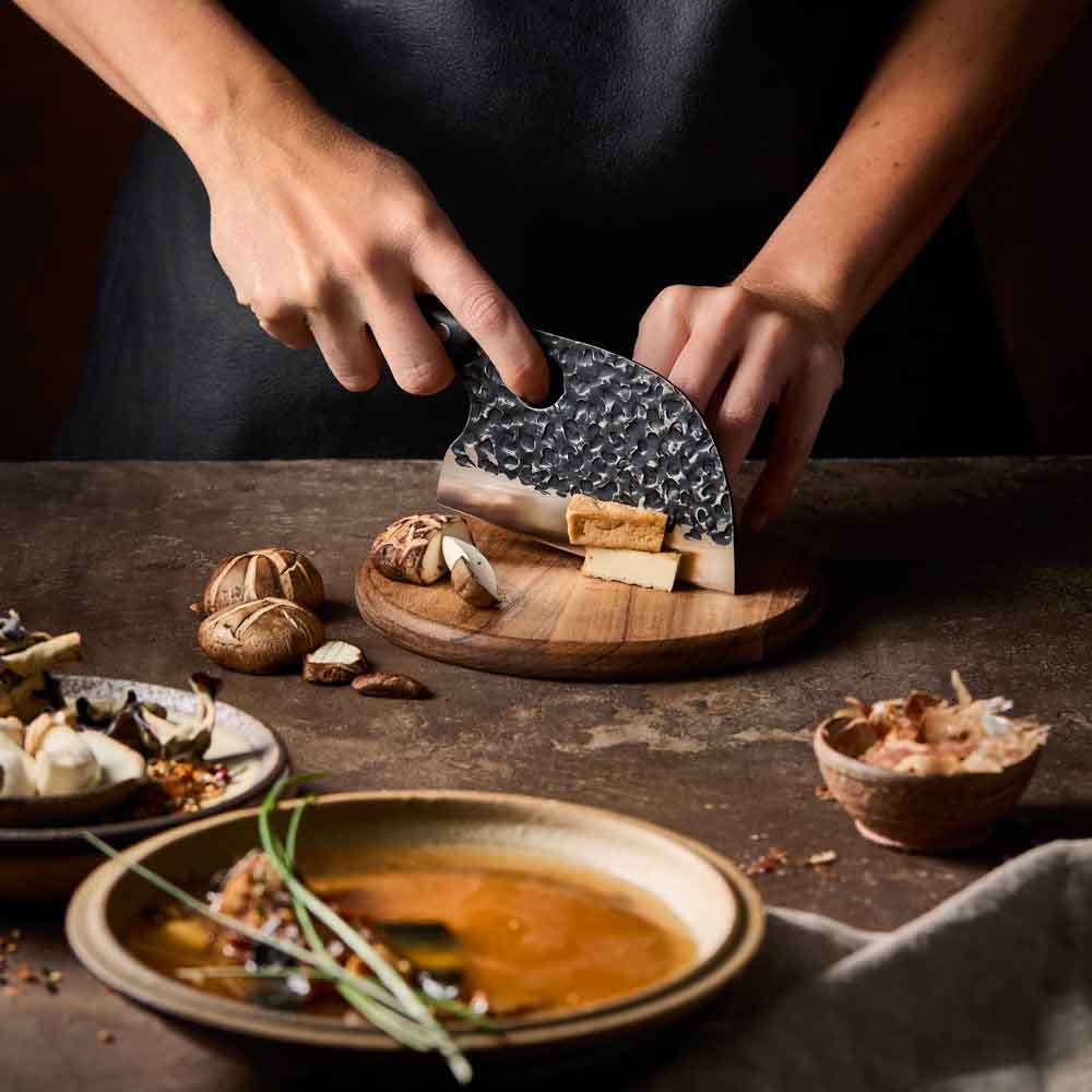 Woman slicing tofu with Baccarat KUROI KIBA Moon Knife 12.5cm at House