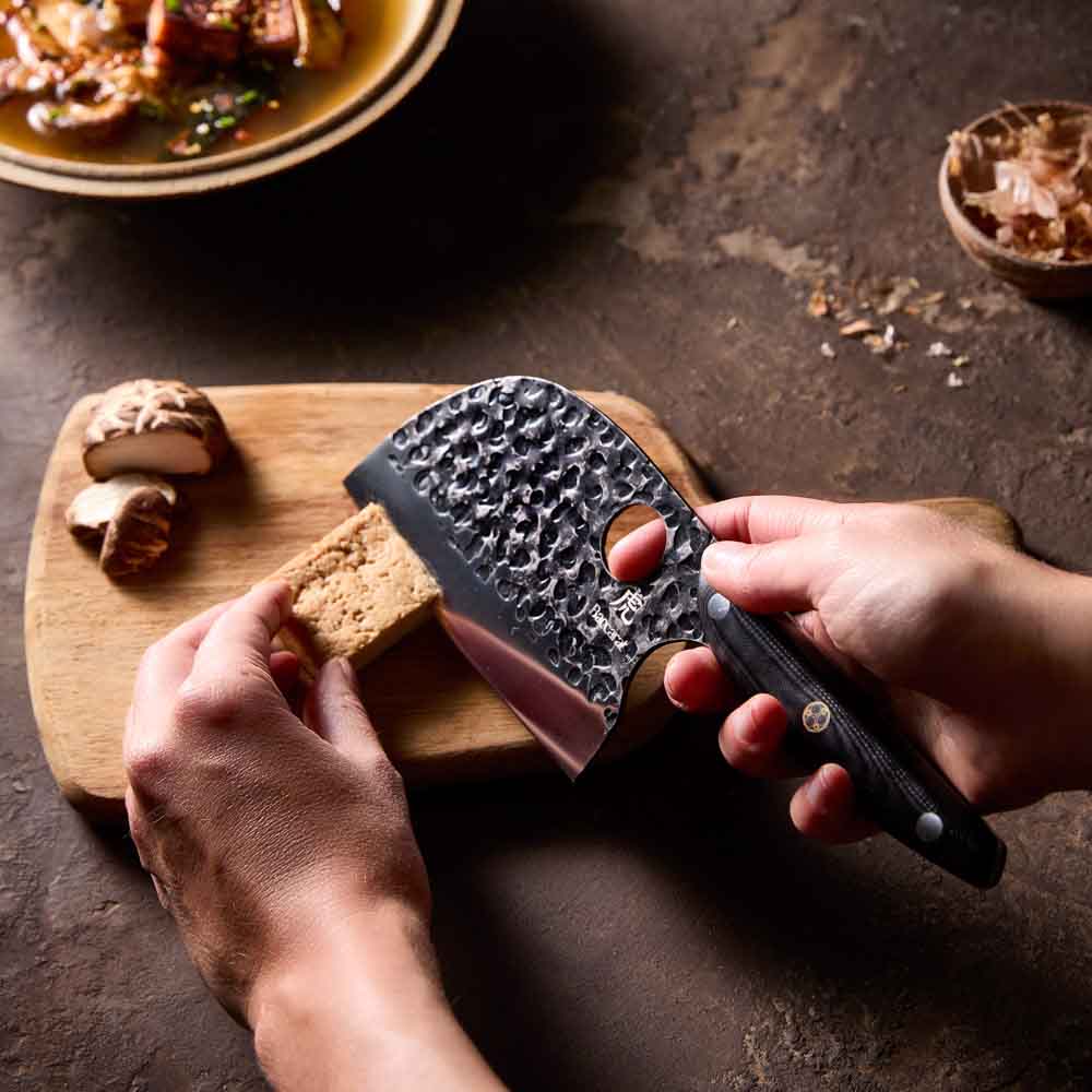 Woman slicing tofu with Baccarat KUROI KIBA Moon Knife 12.5cm at House