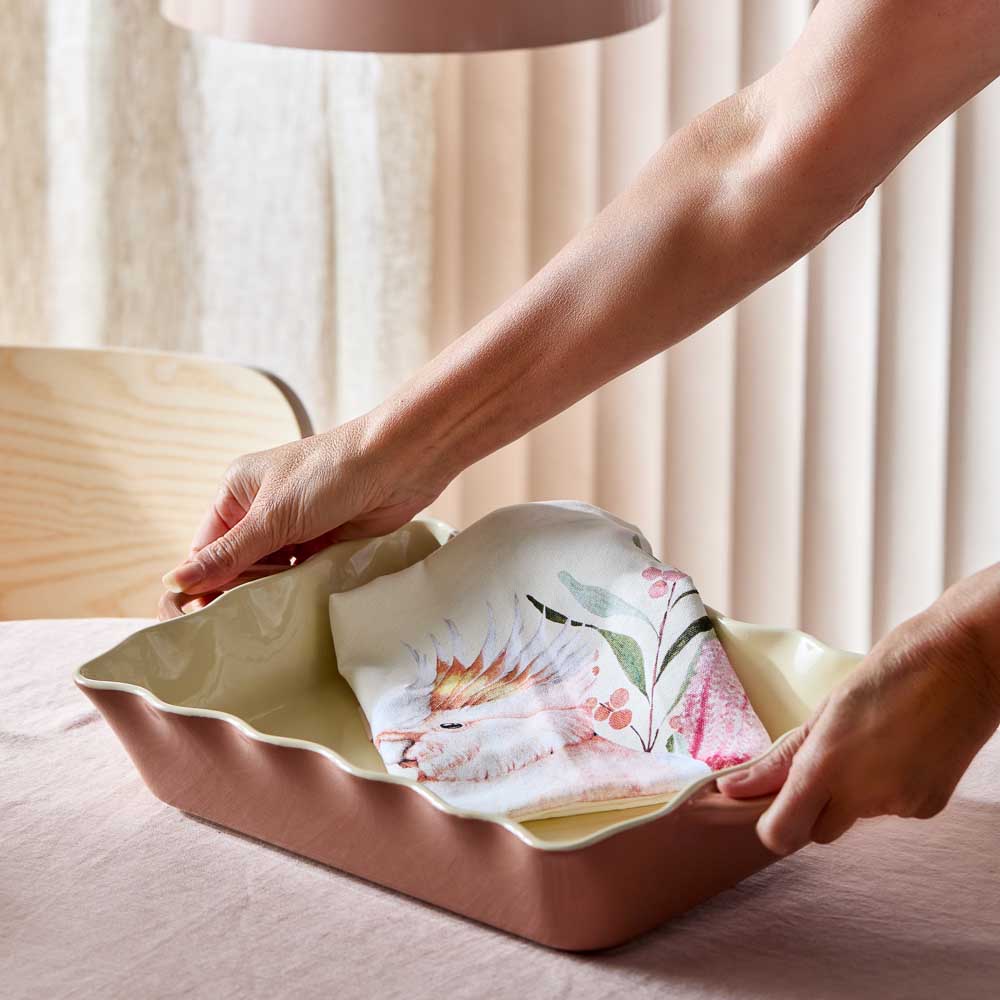 Woman holding Alex Liddy Posy Lasagne Dish 32cm Brown at House