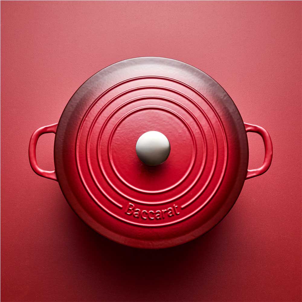 red cast iron dutch french oven with red background - House