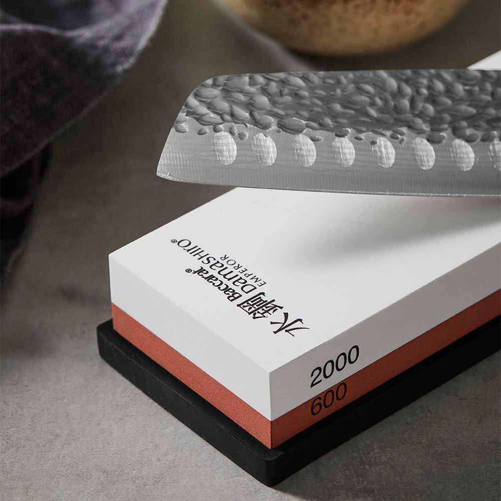 Close up of 600/2000 whetstone and santoku knife - House