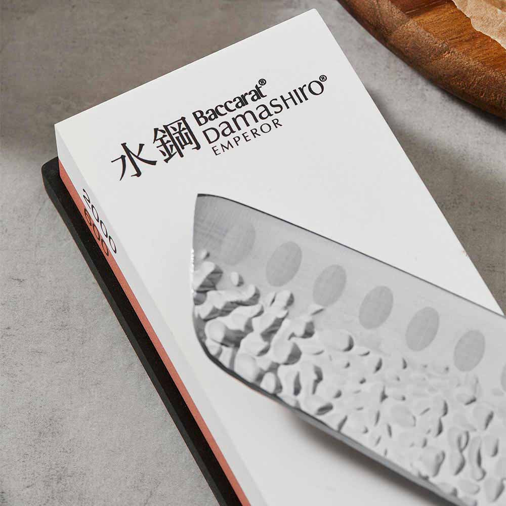 Close up of 600/2000 whetstone and santoku knife - House