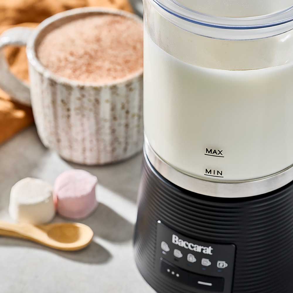 electric glass milk frother with hot chocolate and marshmallows