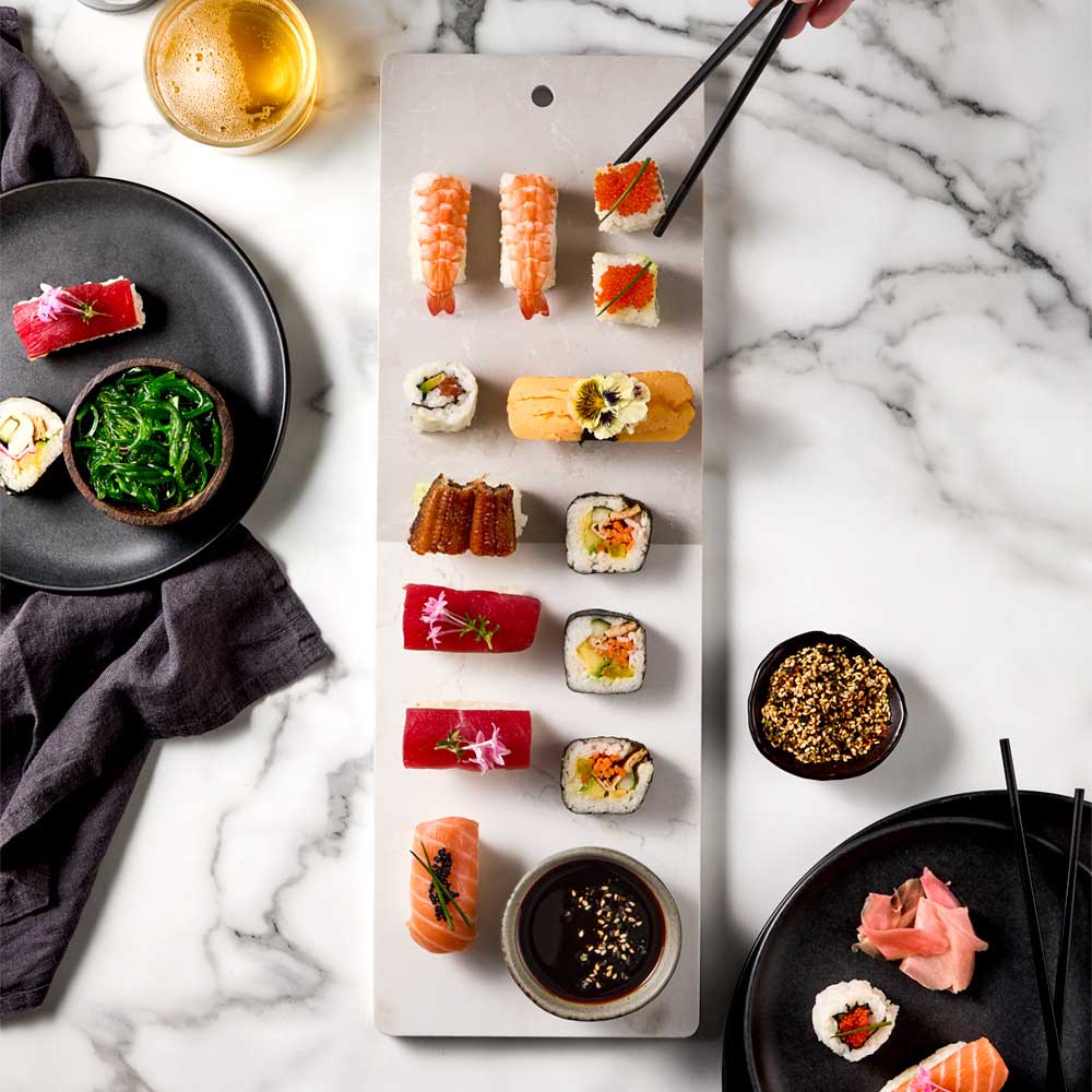 sushi platter on long marble serving board - House