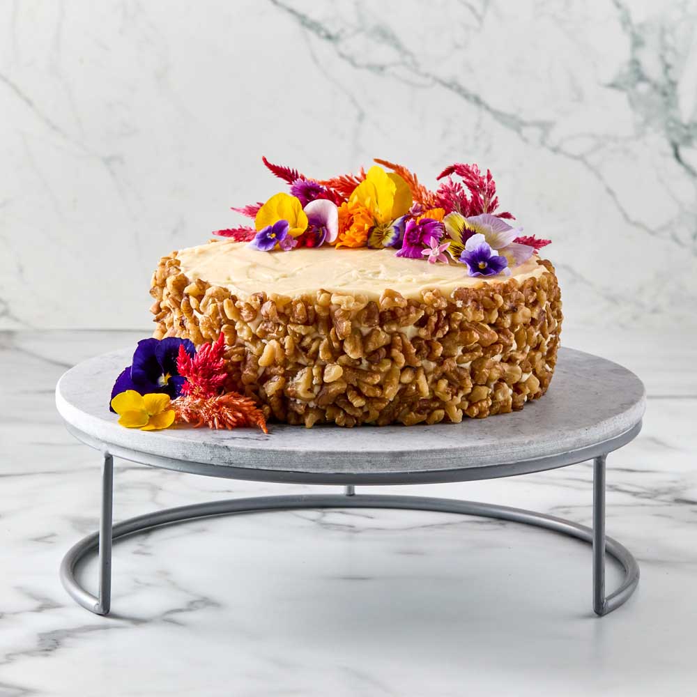decorated carrot cake on a Marble Serving Board with Stand - House