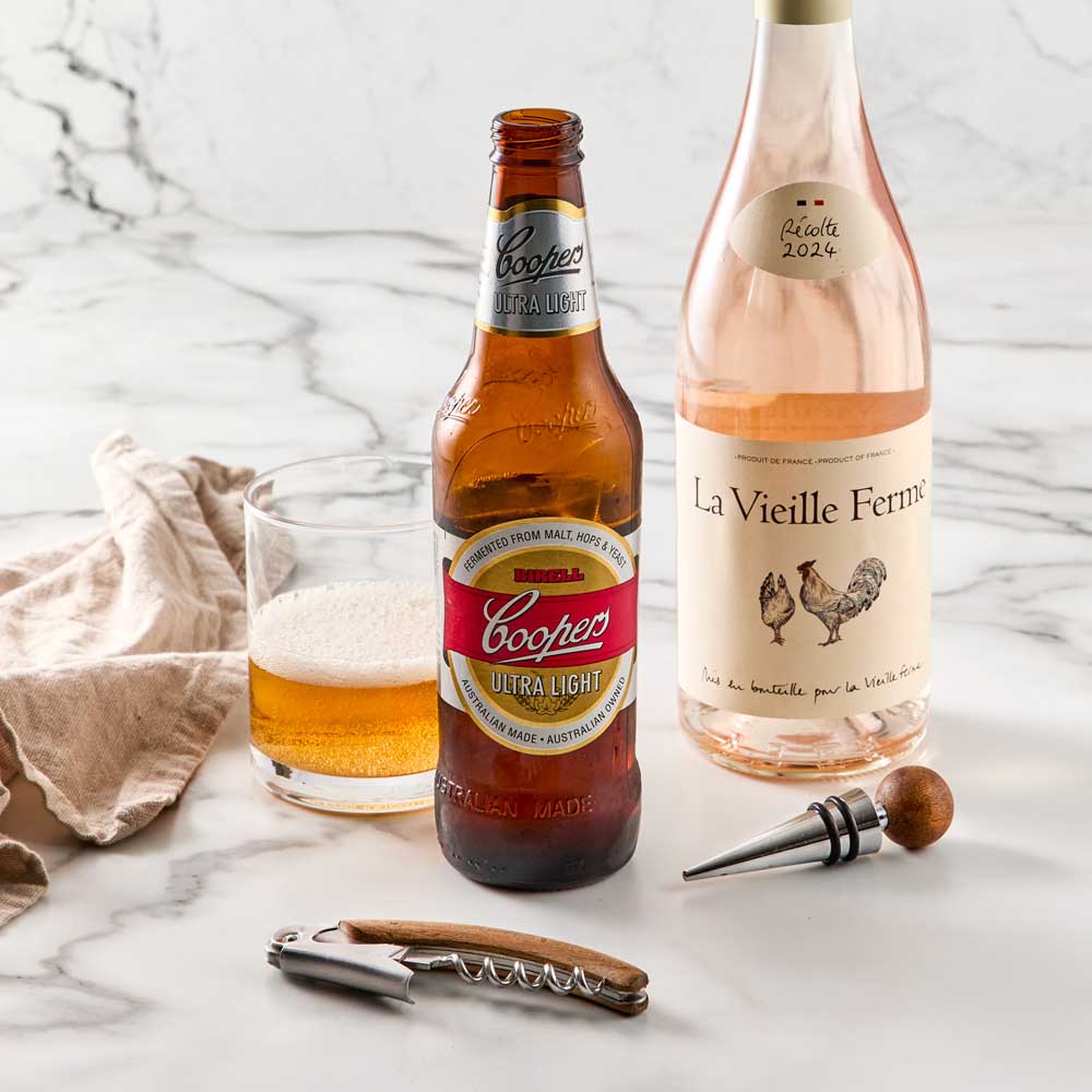 Wood Bottle Opener next to beer and Bottle Stopper  into wine bottle - House