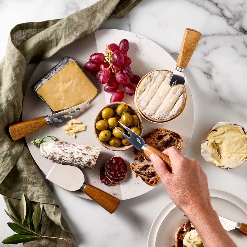 5 Acacia Wood Cheese Knives on marble board with charcuterie - House