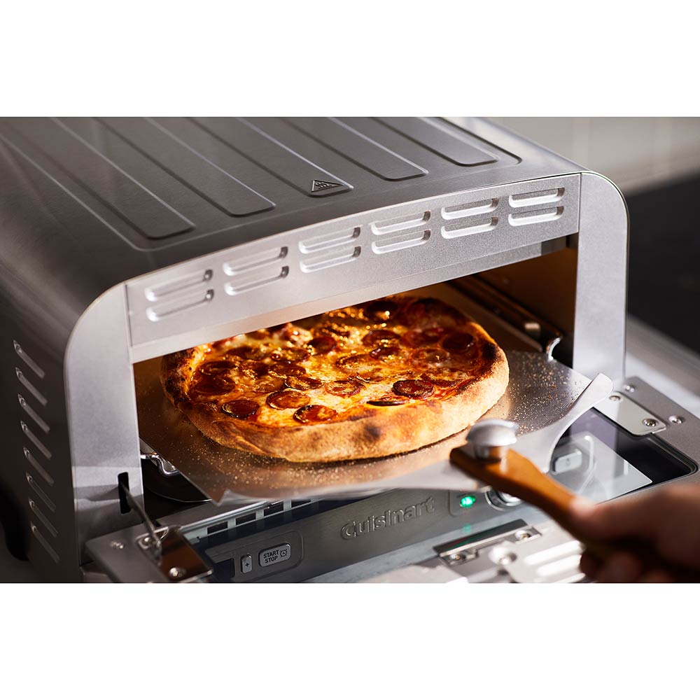 Pizza being removed from Indoor Pizza Oven - House