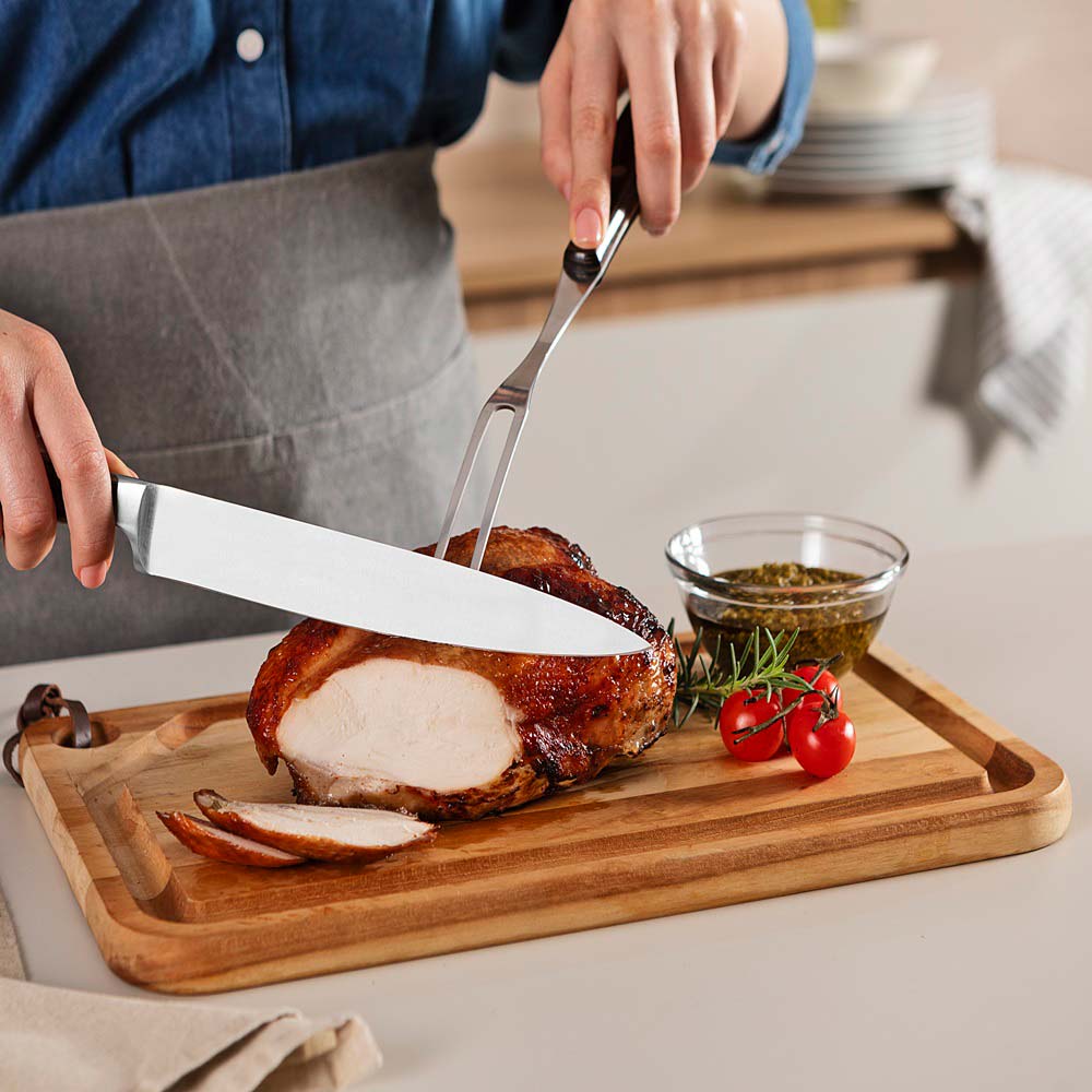woman carving roast at kitchen bench with Utility Carving Knife - House