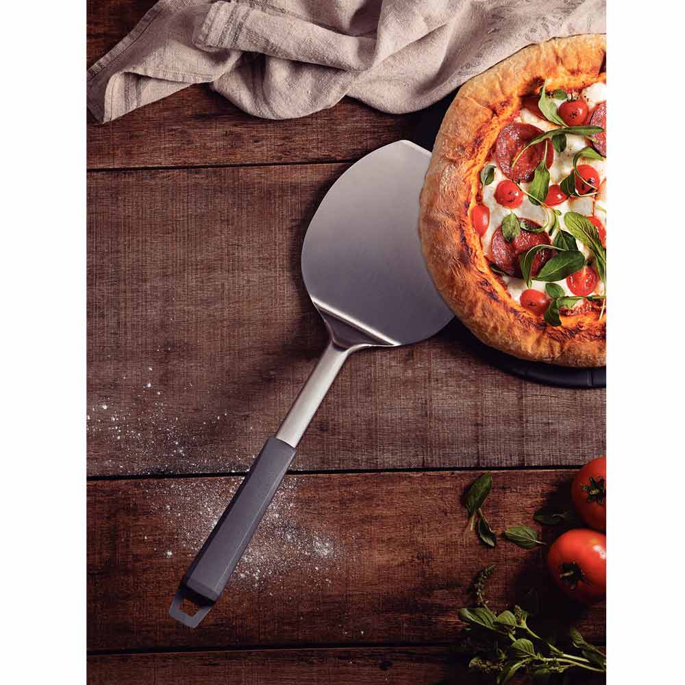 Tramontina Pizza Spatula - Paddle scooped under pizza - House