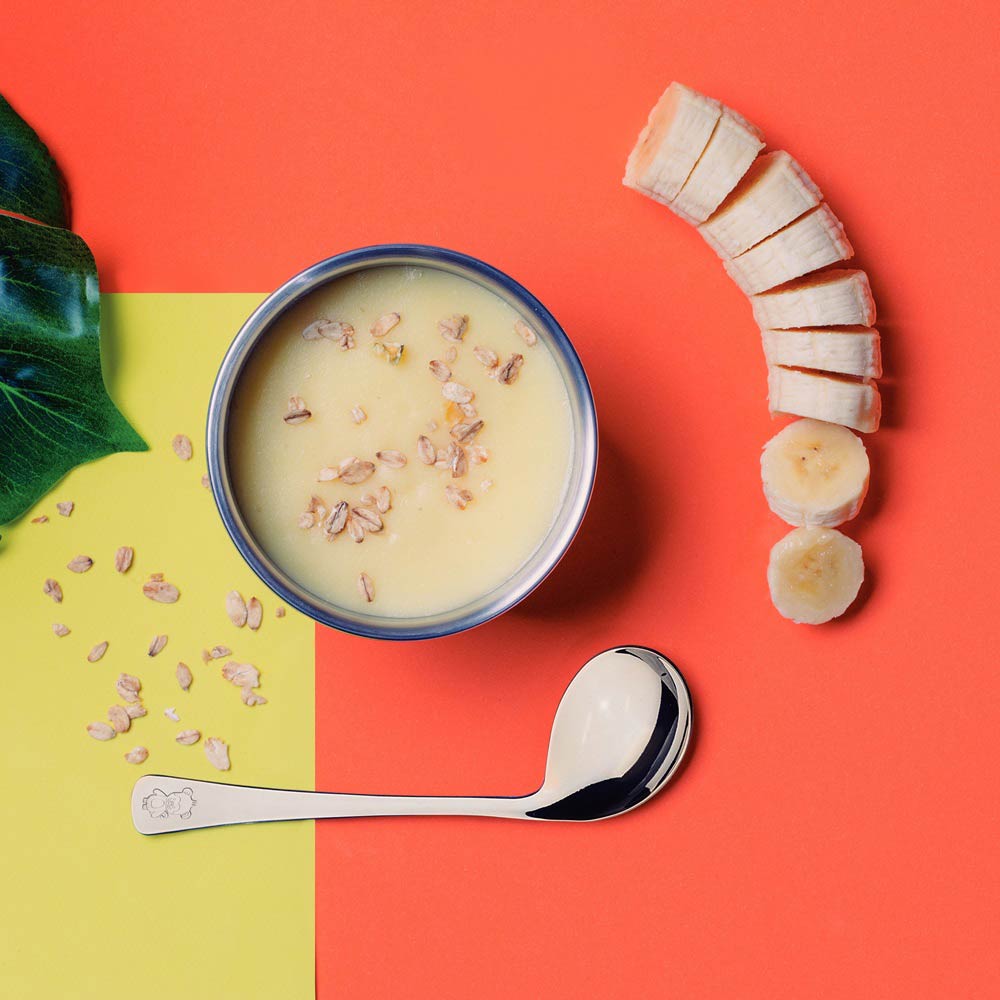 Curved Baby Spoon with bowl of porridge and banana - House