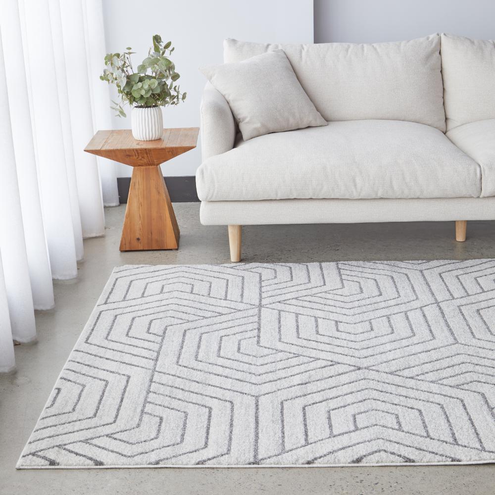 grey modern rug with cream lounge and wood side table - House