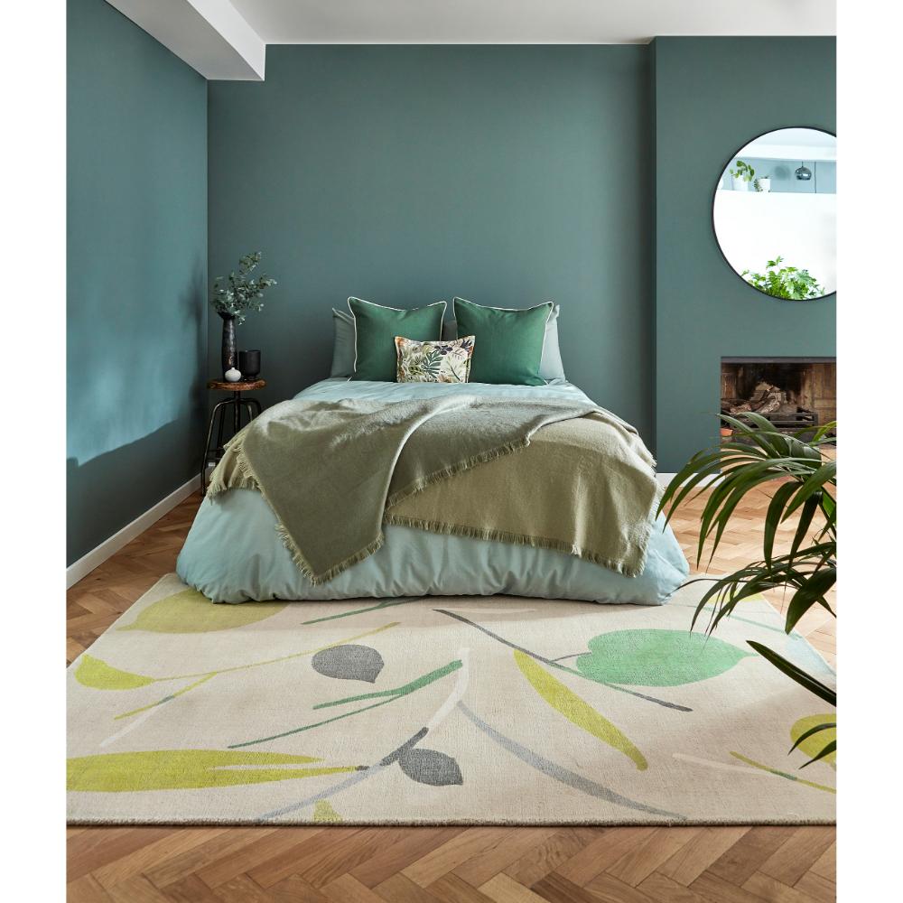 Green Leaf Print Wool Rug in bedroom with green walls - House