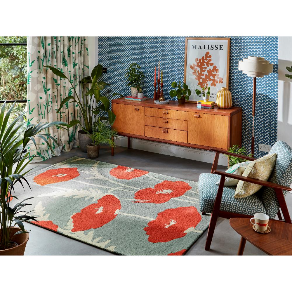 sage wool rug with red poppies in sitting area - House