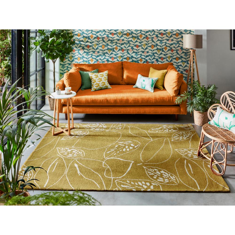 yellow leaf wool rug with orange couch in loungeroom - House