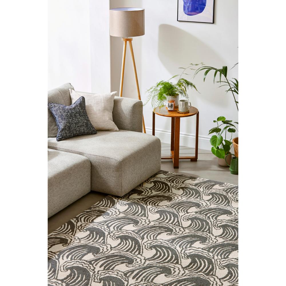 grey wave print wool rug in loungeroom with side table - House