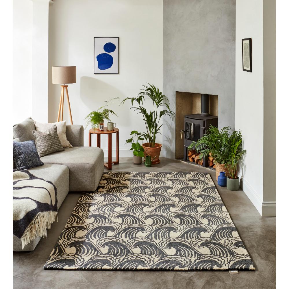 grey wave print wool rug in loungeroom with fireplace - House