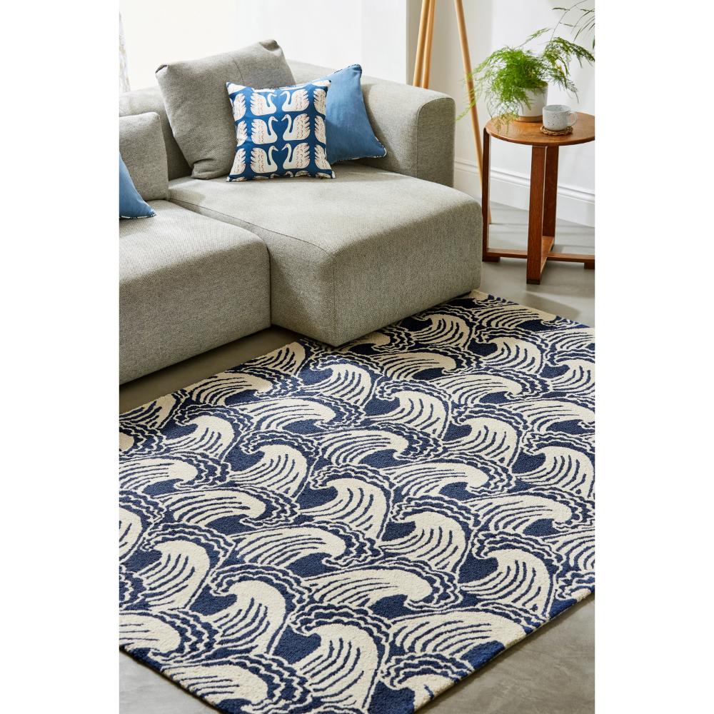 blue wave print wool rug in loungeroom with side table - House
