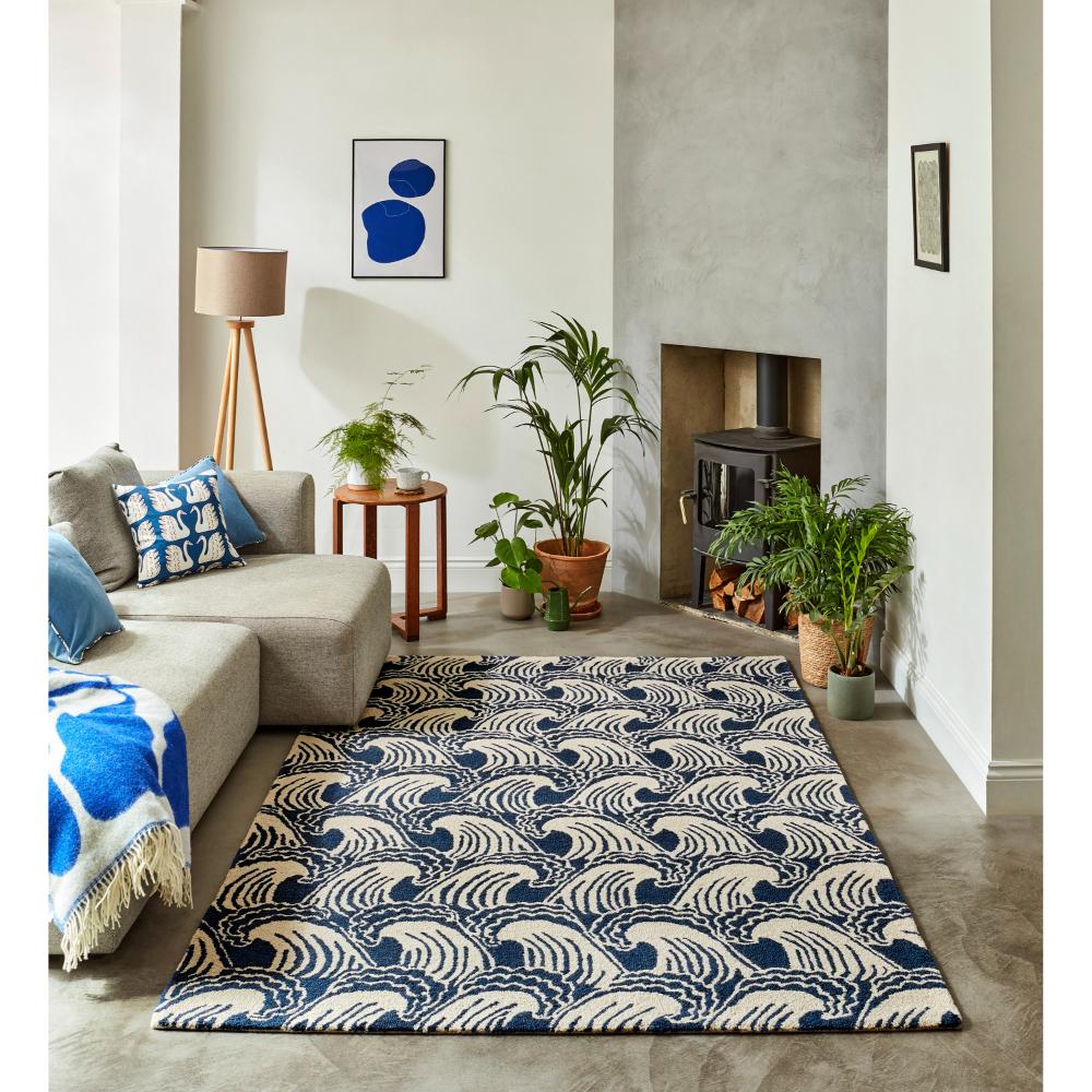 blue wave print wool rug in loungeroom with fireplace - House
