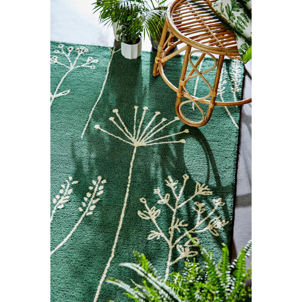 green flower stem wool rug with plants and stool - House