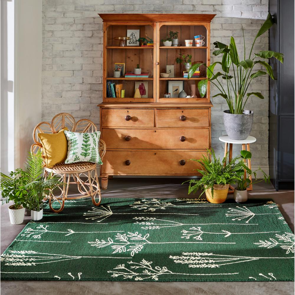 green flower stem wool rug with plants and sitting room - House