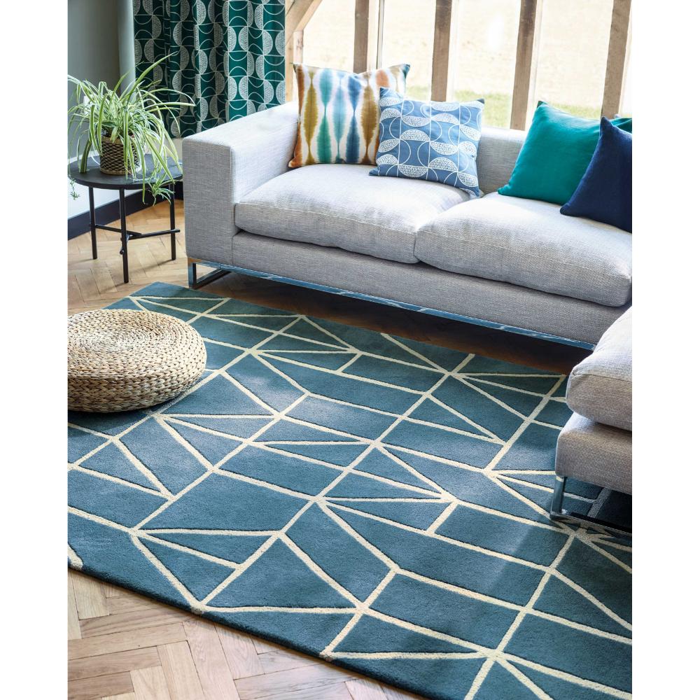 blue geometric wool rug with grey lounge - House