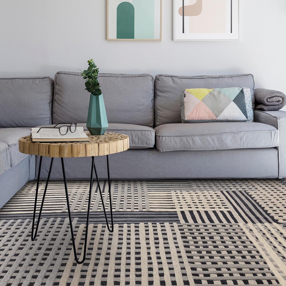 Wool basketweave design rug in grey with couch