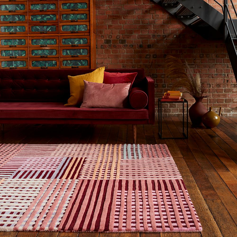 Wool basketweave design rug in red with couch