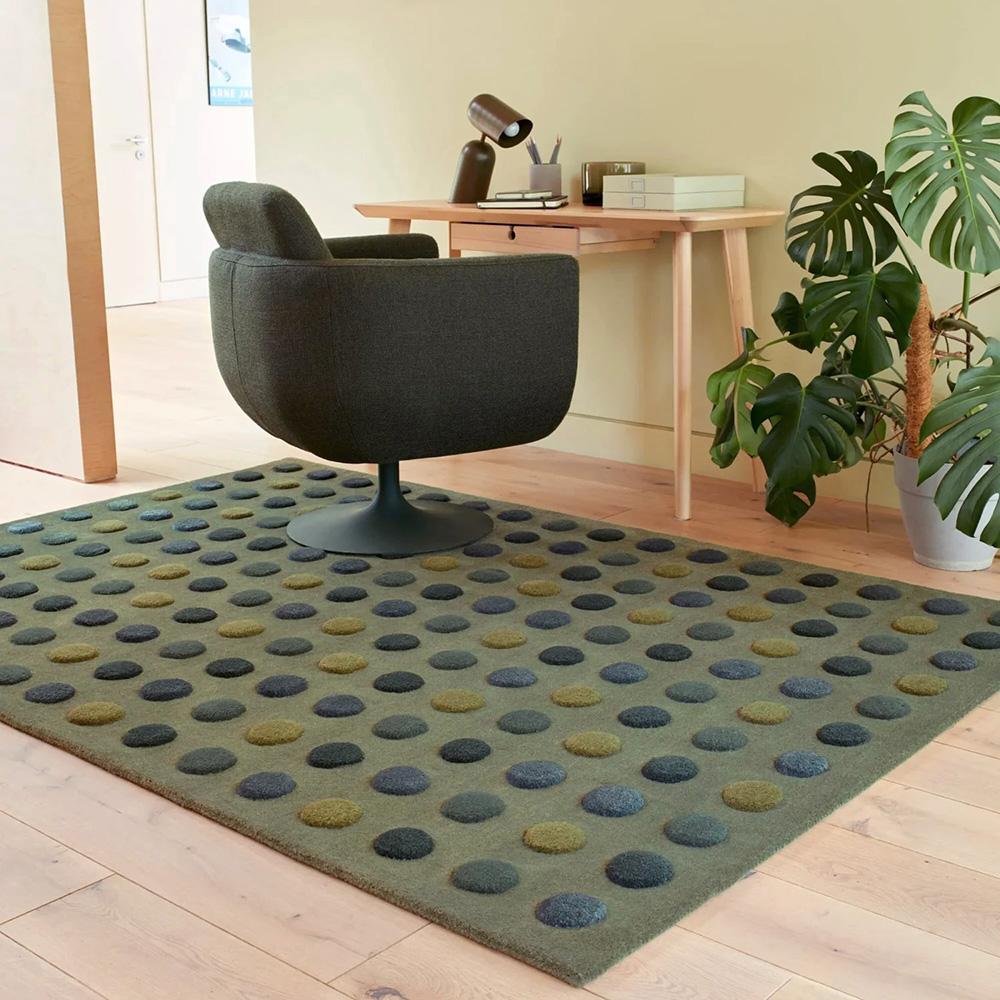 green dot wool rug under a study desk