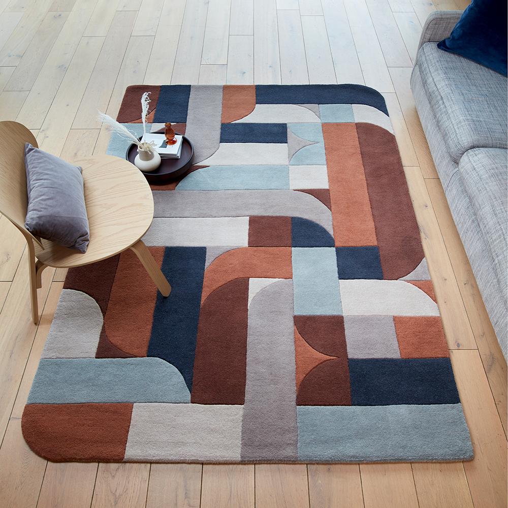 wool rug with curved block design in blue and brown