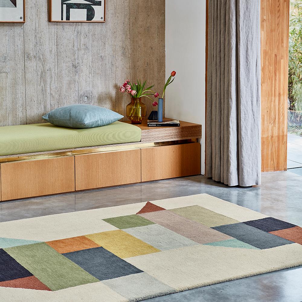 multi-coloured jagged block design wool rug