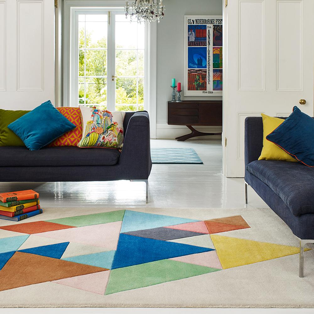 multicoloured triangle design wool rug in loungeroom