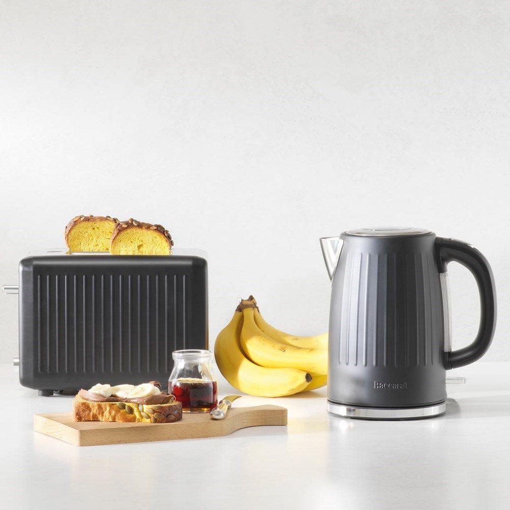 Baccarat The Boiling Point Kettle in Black at House. Black kettle with ribbed detail and matching toaster.