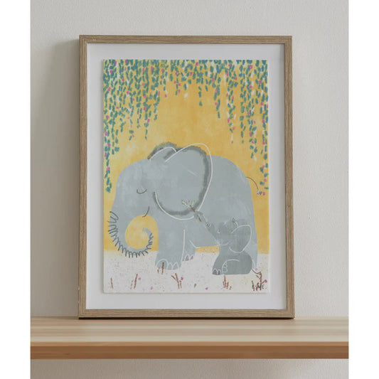 Framed artwork of two elephants under a weeping willow tree on a yellow background.