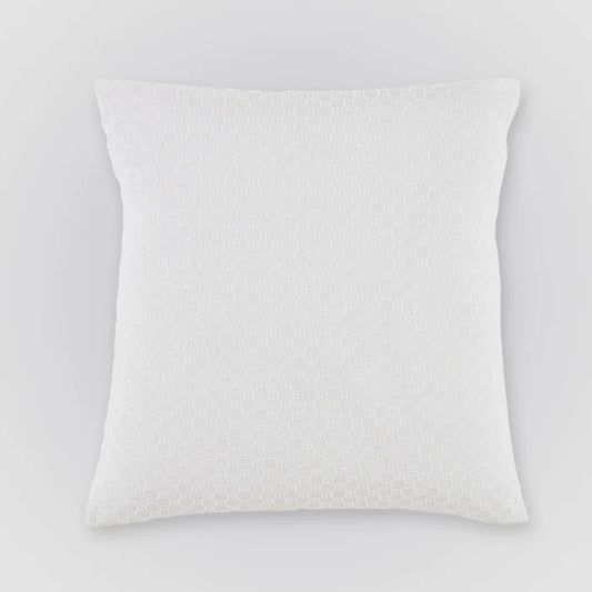 White textured pillow on a light gray background